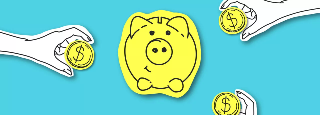 A piggy bank with coins surrounding it.