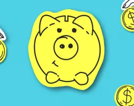 A piggy bank with coins surrounding it.